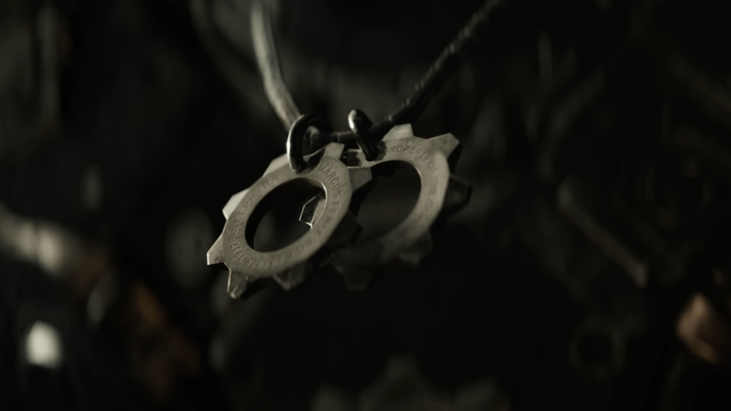 Close-up of metal cog-shaped pendant necklace